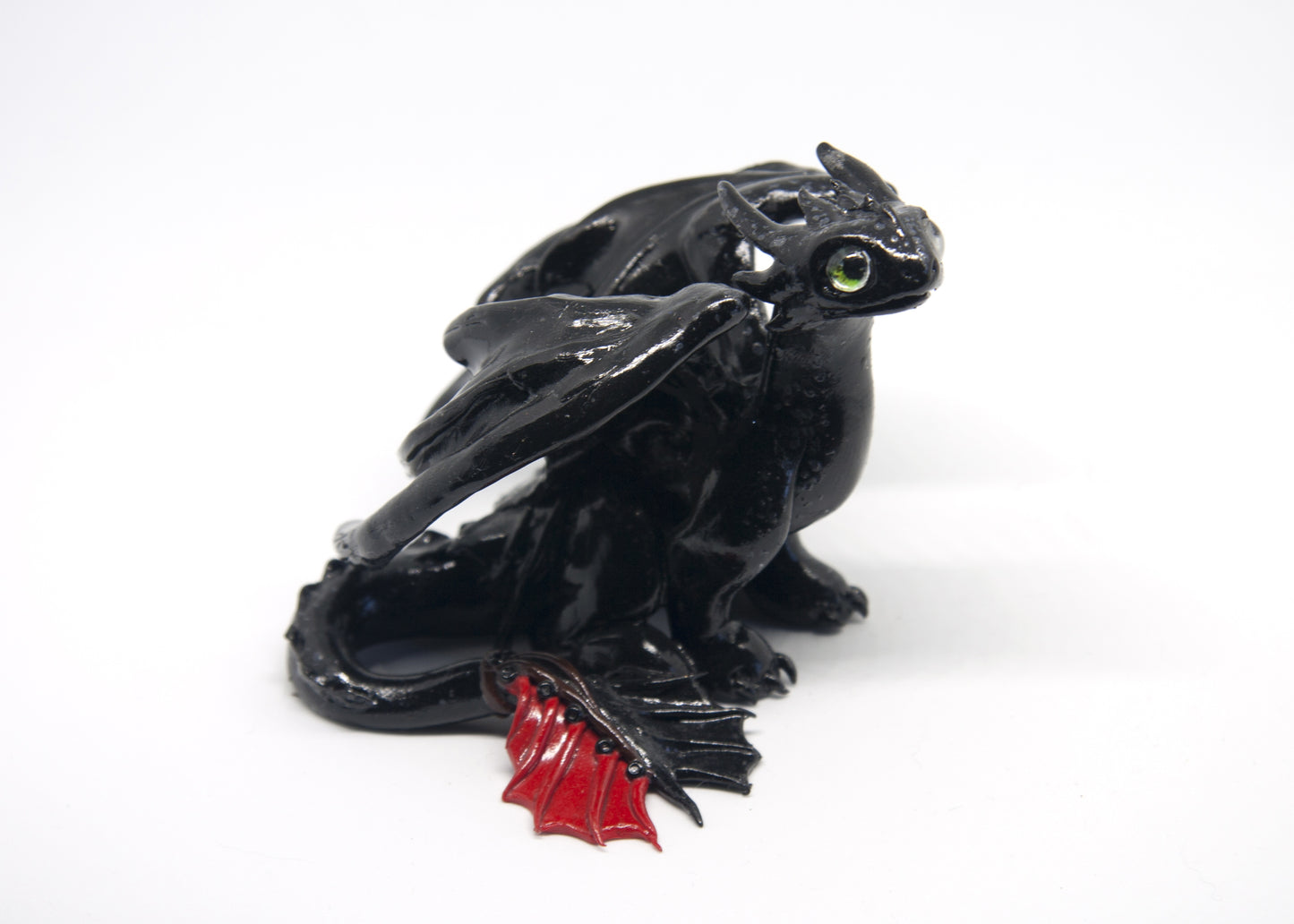 Black dragon sitting down unique figurine