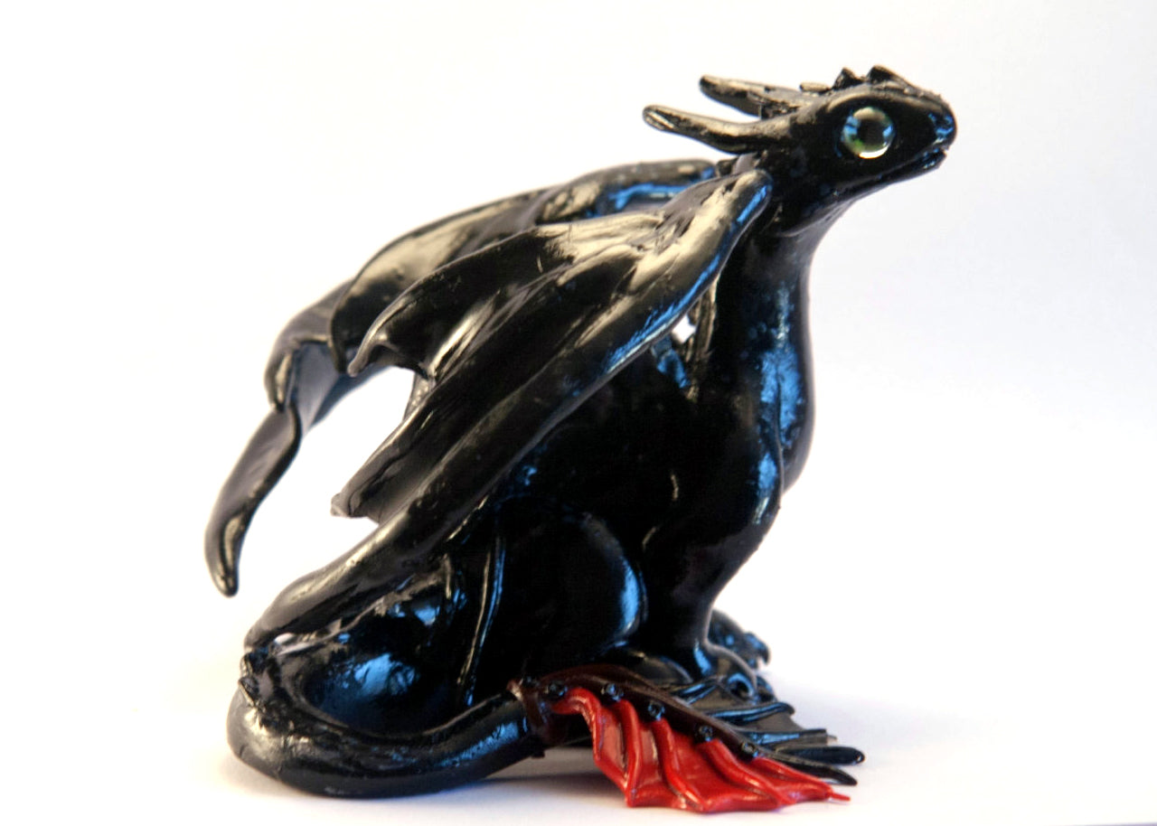 Black dragon sitting down unique figurine