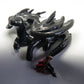 Black dragon laying down unique figurine