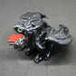 Black dragon sitting down unique figurine