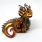 Gold and silver sitting down dragon unique figurine