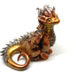 Gold and silver sitting down dragon unique figurine