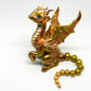 Light gold unique figurine with moveable tail