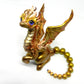 Light gold unique figurine with moveable tail