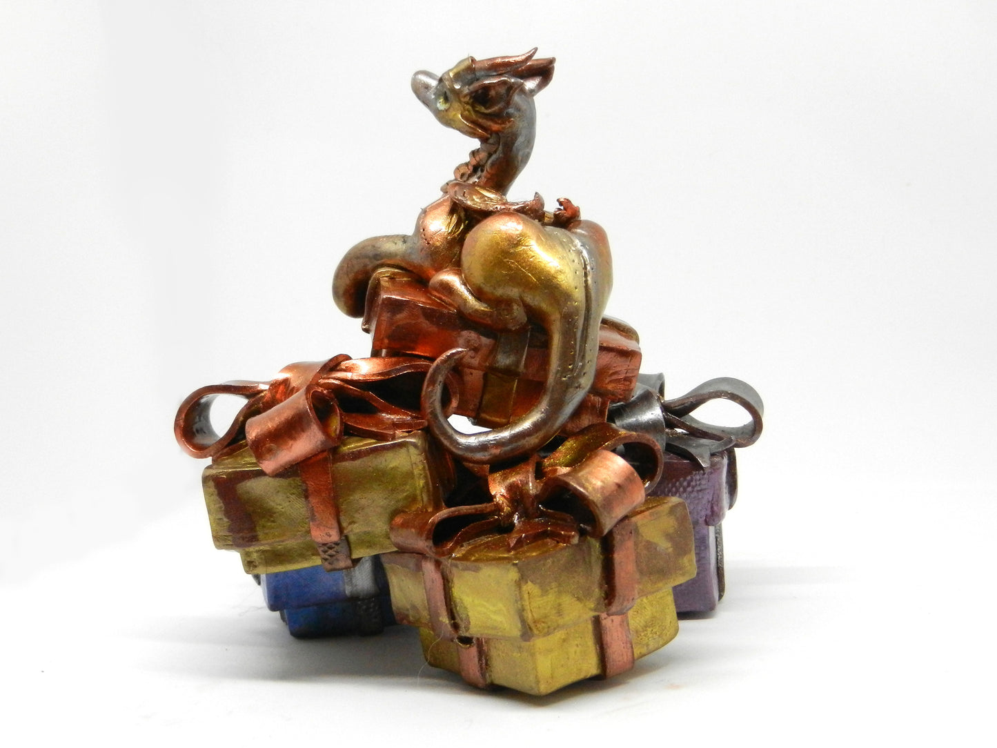 Baby dragon on top off pile of presents unique figurine