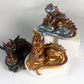 Figurine of a dragon laying down