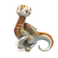 Figurine d'un dragon assis