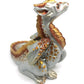 Figurine d'un dragon assis