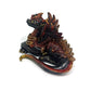 Figurine of a dragon laying down