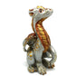Figurine d'un dragon assis